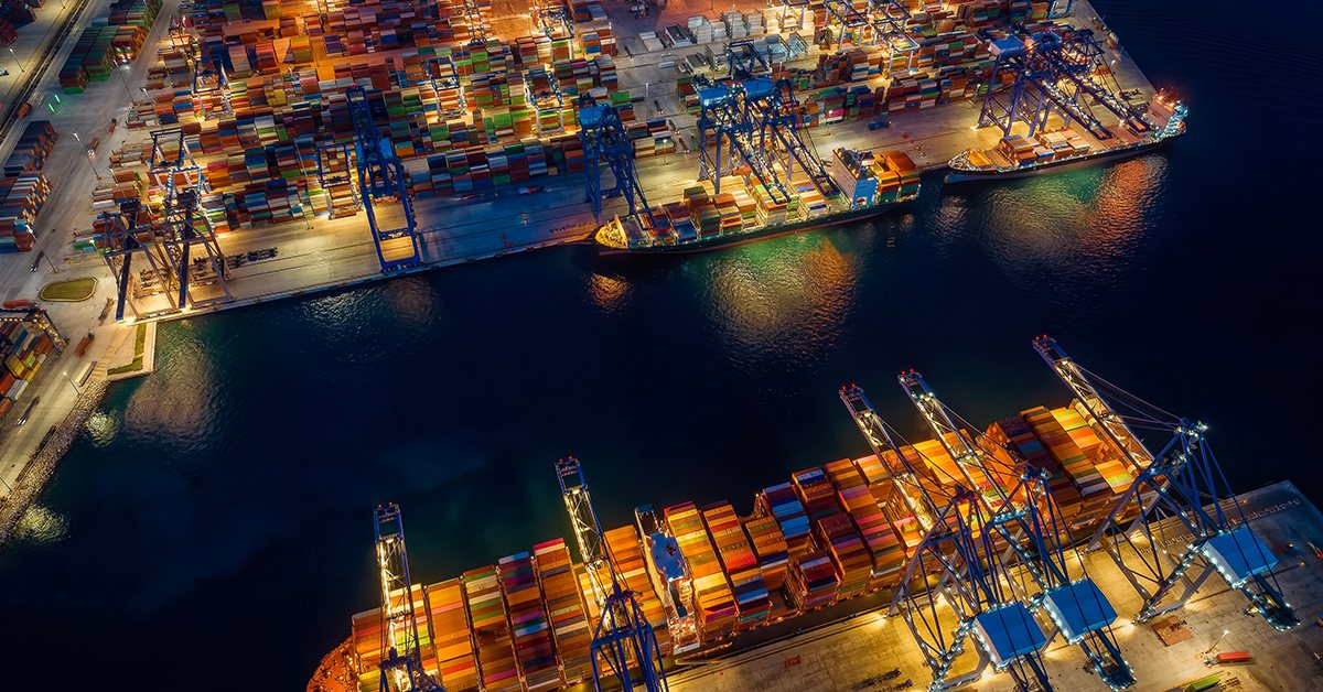 Container terminal at night — global container market (Daily Cargo News)